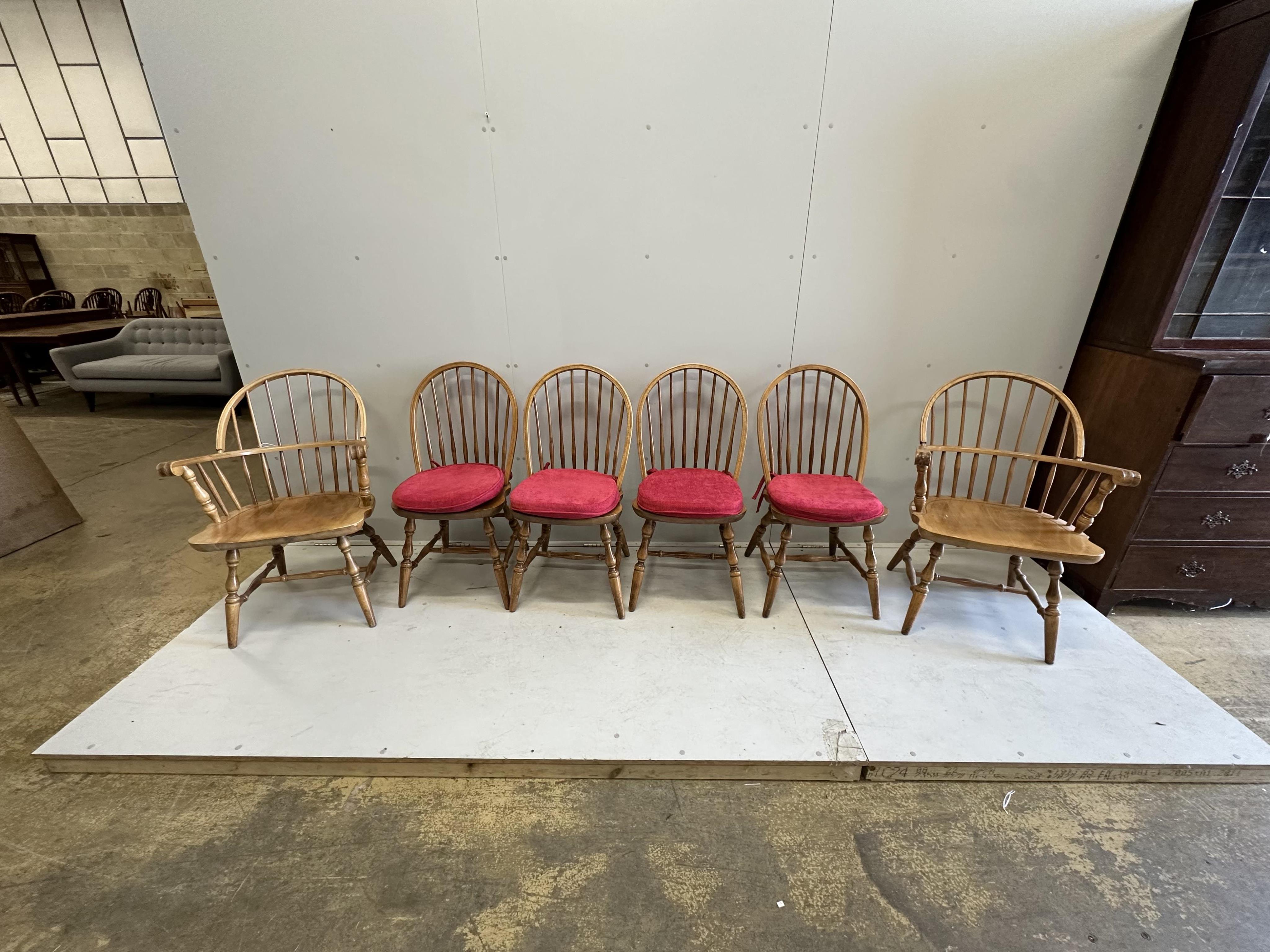 A set of six beech Windsor dining chairs, two with arms. Condition - fair